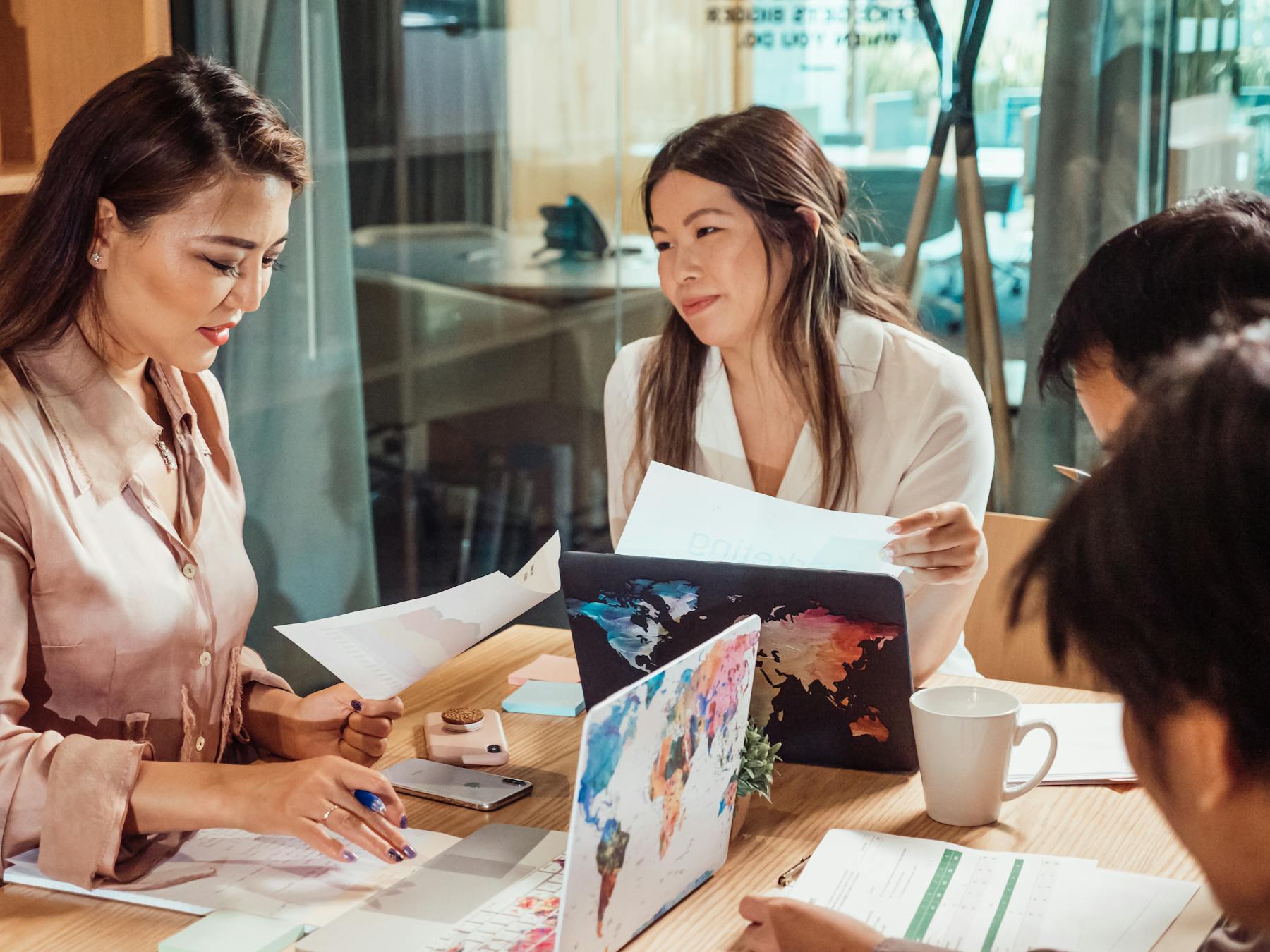 Business team in office strategy meeting around shared documents